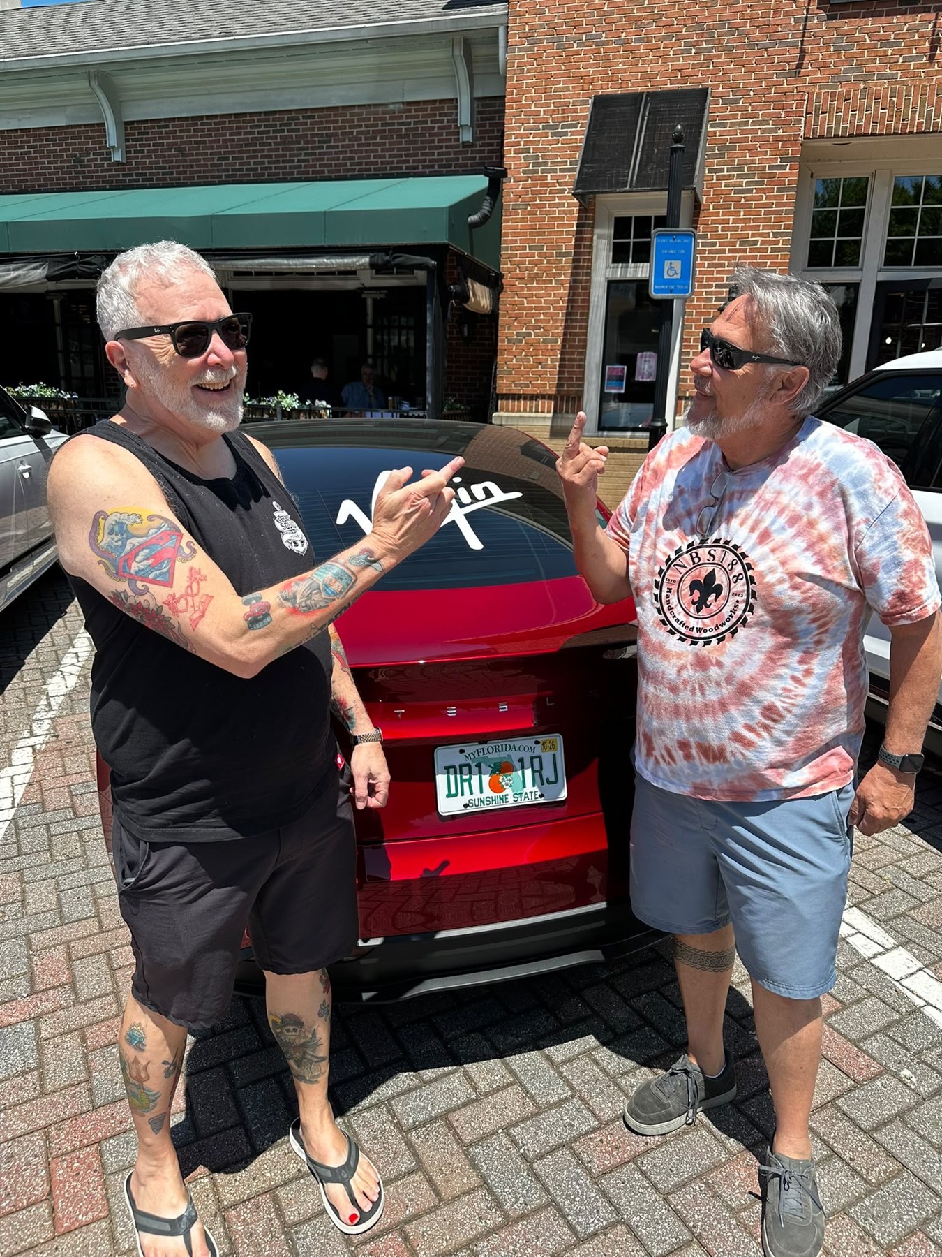 Another moment with Mark and Steven beside the Virgin-branded Tesla